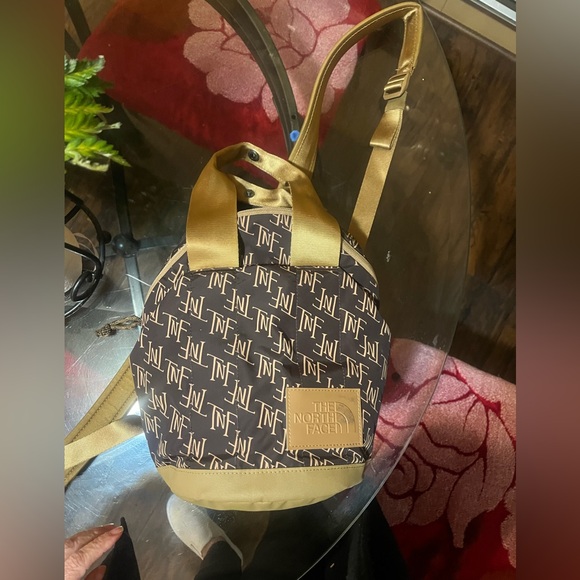 The North Face Handbags - The North Face Black and Gold Women's Backpack